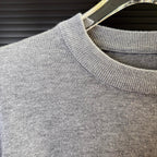 Gray knit sweater shoulder with ribbed collar