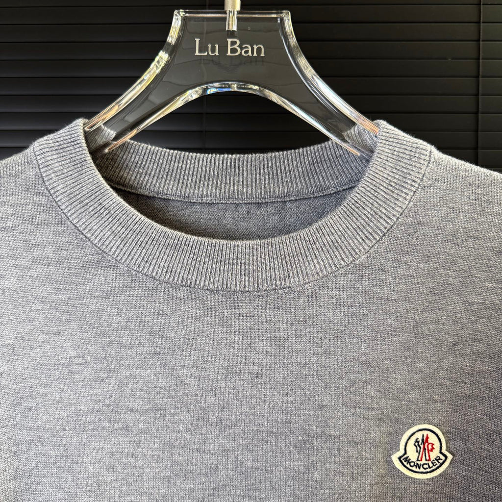 Gray crewneck knit sweater collar ribbing