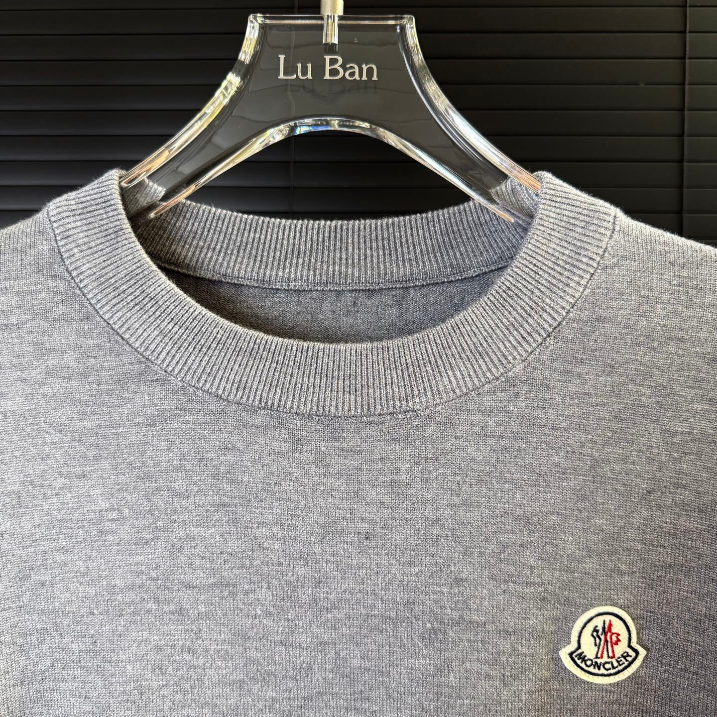 Gray crewneck knit sweater collar ribbing
