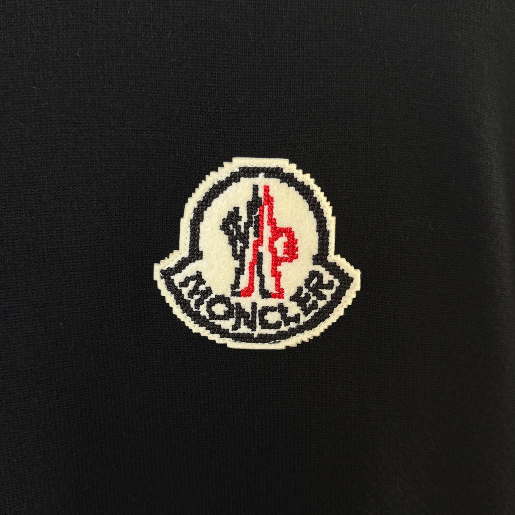 Black Moncler embroidered logo patch on sweater chest