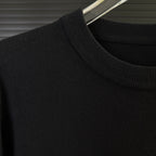 Black Moncler sweater shoulder with ribbed knit collar and smooth knit body