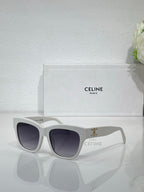 Celine sunglasses with light gray frames and dark lenses, gold logo on temple