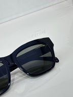 Celine sunglasses close-up with dark navy frames and dark tinted lenses