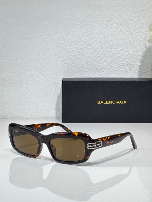 Balenciaga sunglasses with tortoise frames and brown lenses, gold logo on temples