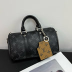 Louis Vuitton monogram handbag with tan keychain charm and leather pouch accessory