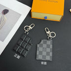 Louis Vuitton keychain charm set with black monogram and gray checker card, silver rings