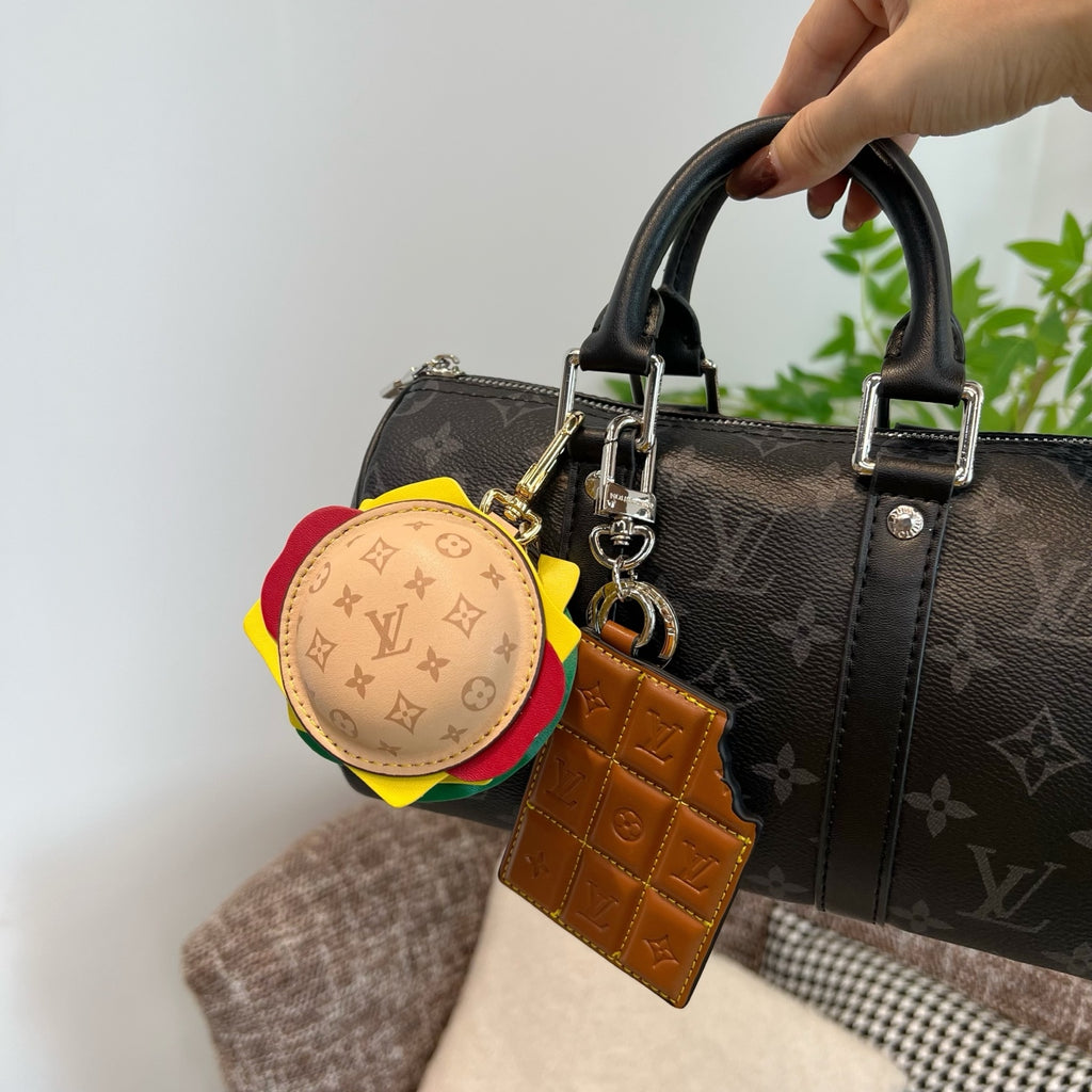 Louis Vuitton monogram handbag with round multicolor charm and tan leather key holder