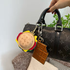 Louis Vuitton monogram handbag with round multicolor charm and tan leather key holder