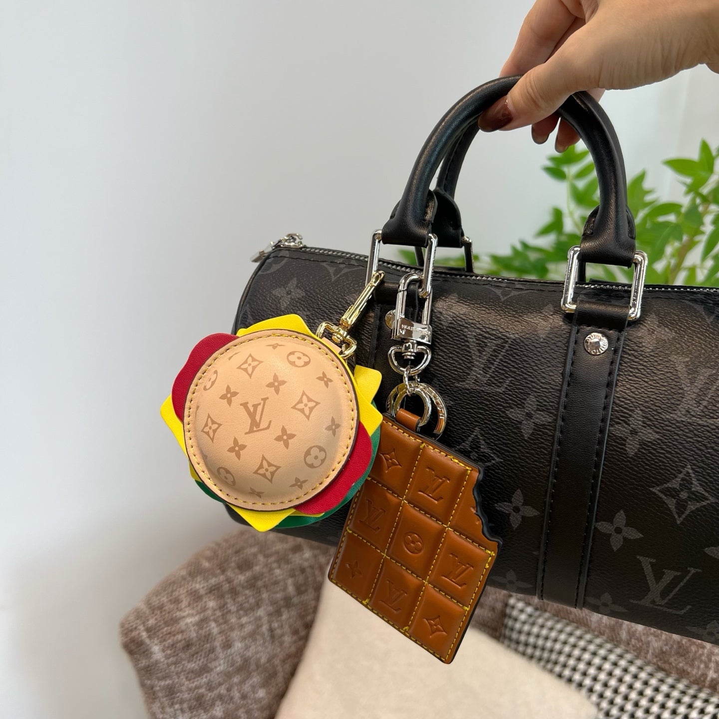 Louis Vuitton monogram handbag with round multicolor charm and tan leather key holder