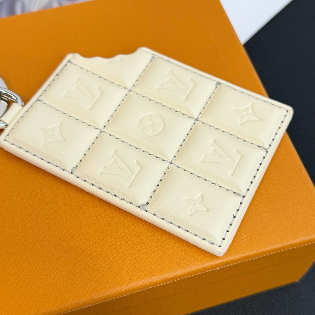 Louis Vuitton cream quilted monogram card holder with grid stitching and emblem