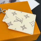Louis Vuitton cream monogram card holder with floral motifs and scalloped edge