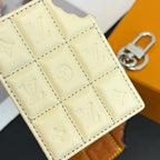 Louis Vuitton cream quilted monogram card holder close-up with stitched panels