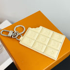 Louis Vuitton cream quilted monogram card holder keychain with silver rings