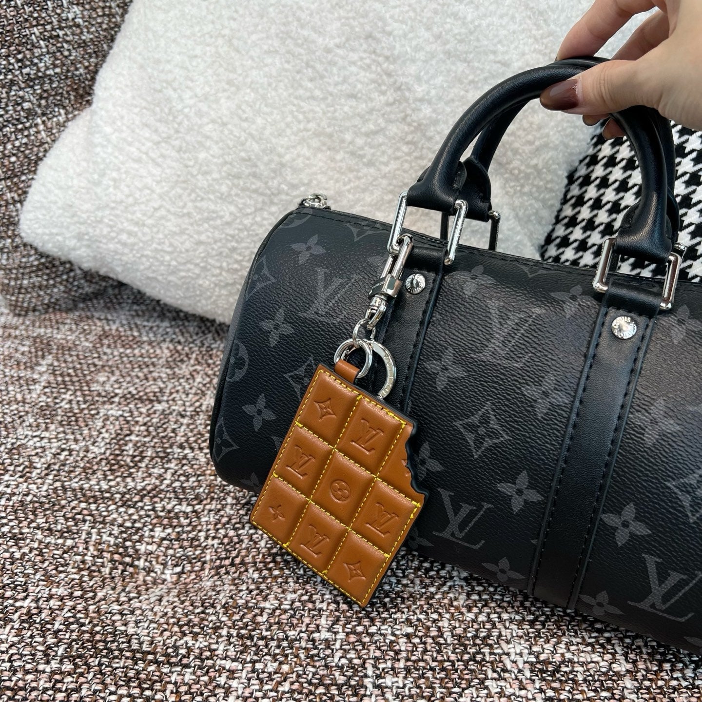 Louis Vuitton monogram handbag with tan leather key holder charm and metal ring clip