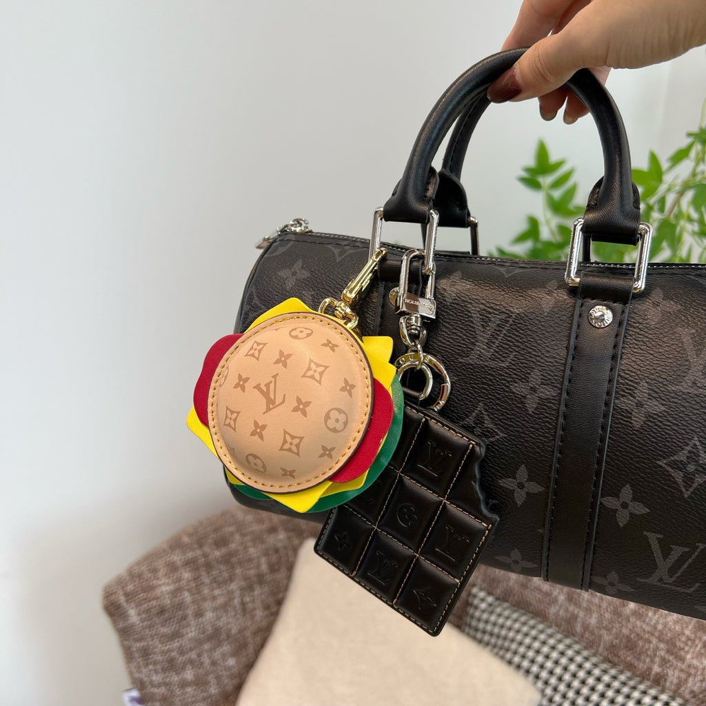 Louis Vuitton monogram handbag with round multicolor charm and hanging leather organizer