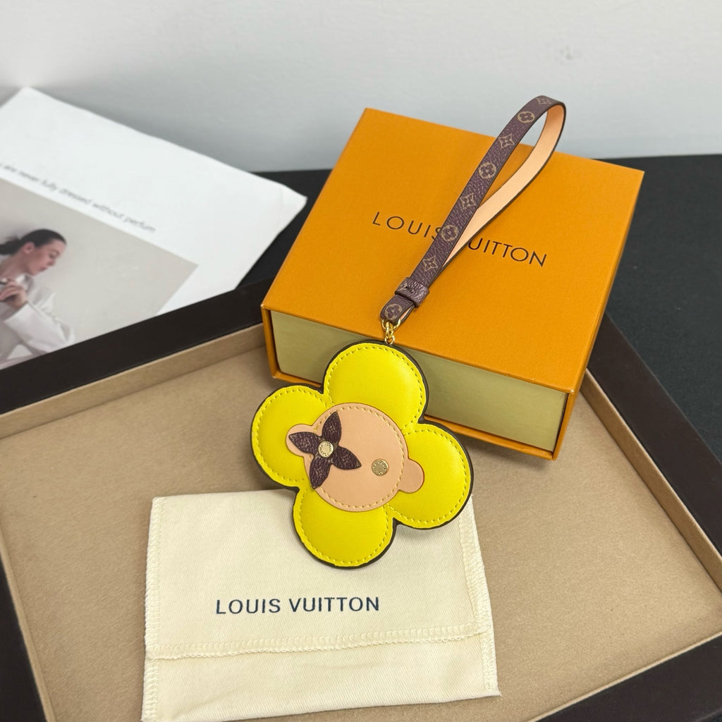 Louis Vuitton keychain: yellow flower leather with dog face, logo strap