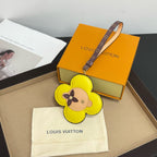 Louis Vuitton keychain: yellow flower leather with dog face, logo strap