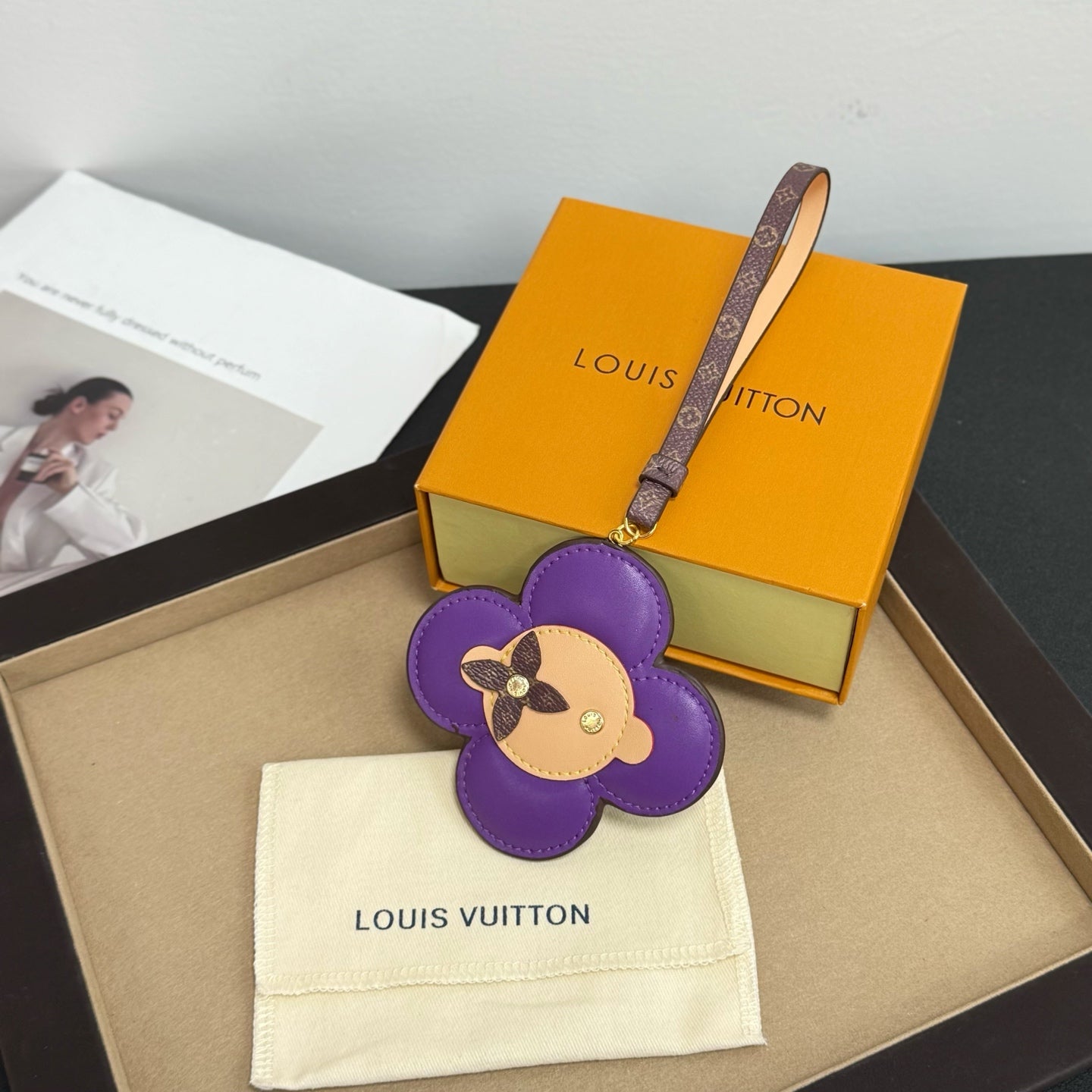Louis Vuitton keychain: purple flower leather with dog face, logo strap