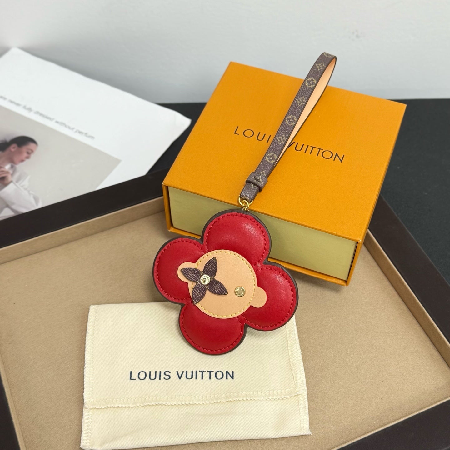 Louis Vuitton keychain: red flower leather with dog face, logo strap