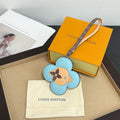 Louis Vuitton keychain: light blue flower leather with dog face, logo strap