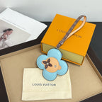 Louis Vuitton keychain: light blue flower leather with dog face, logo strap