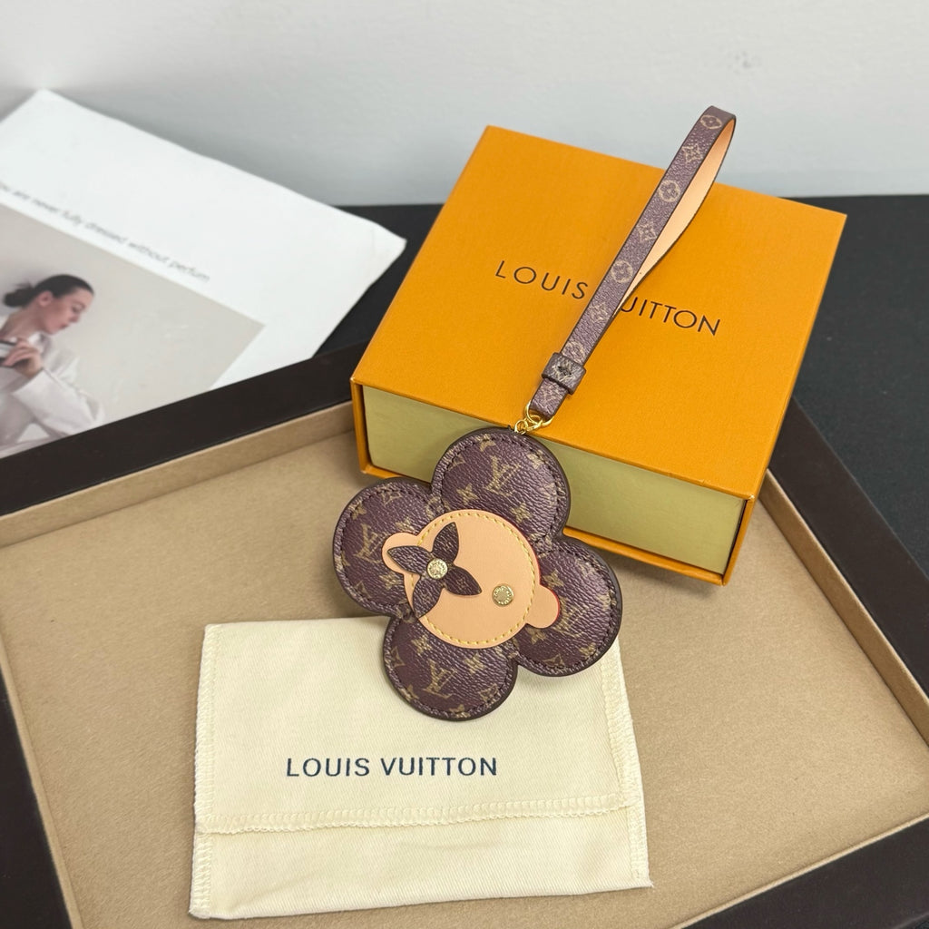 Louis Vuitton keychain: brown monogram flower with dog face, logo strap