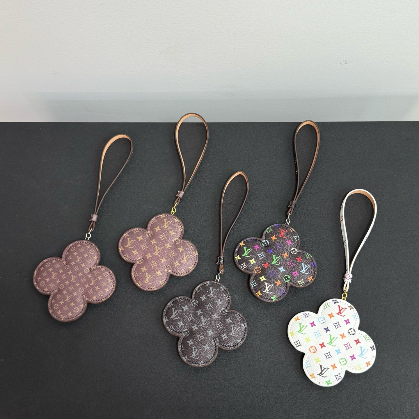 Assorted Louis Vuitton flower keychains with logo straps, mixed colors (set of 5)
