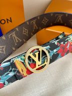 Louis Vuitton belt with dark monogram strap and floral panel, gold-tone oval LV buckle.