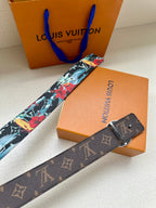 Louis Vuitton belt strap with multicolor floral print and gold-tone oval LV buckle, extended.