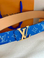 Blue monogram belt with tan leather strap and silver LV buckle close-up