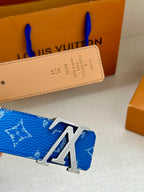 Blue monogram belt with silver LV buckle and tan leather strap detail