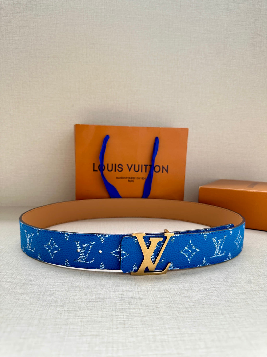 Louis Vuitton belt, blue monogram strap, tan edges, silver LV buckle