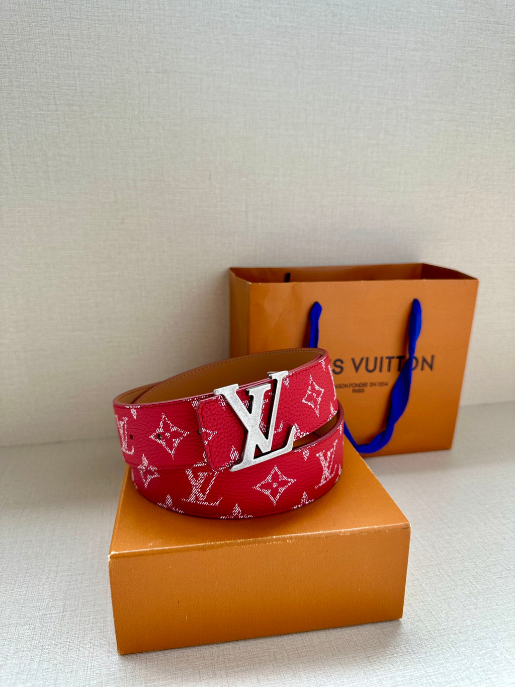 Louis Vuitton red monogram belt with silver-toned LV buckle
