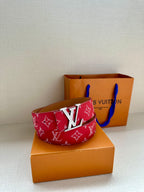 Louis Vuitton red monogram belt with silver-toned LV buckle