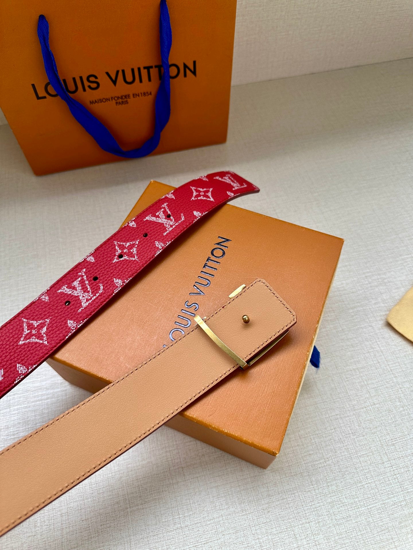 Louis Vuitton red monogram belt strap with tan reverse and belt holes
