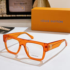 Louis Vuitton eyeglasses with amber orange frames and LV logo on temple, clear lenses