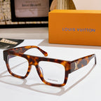Louis Vuitton eyeglasses with tortoiseshell frames and LV logo on temple, clear lenses
