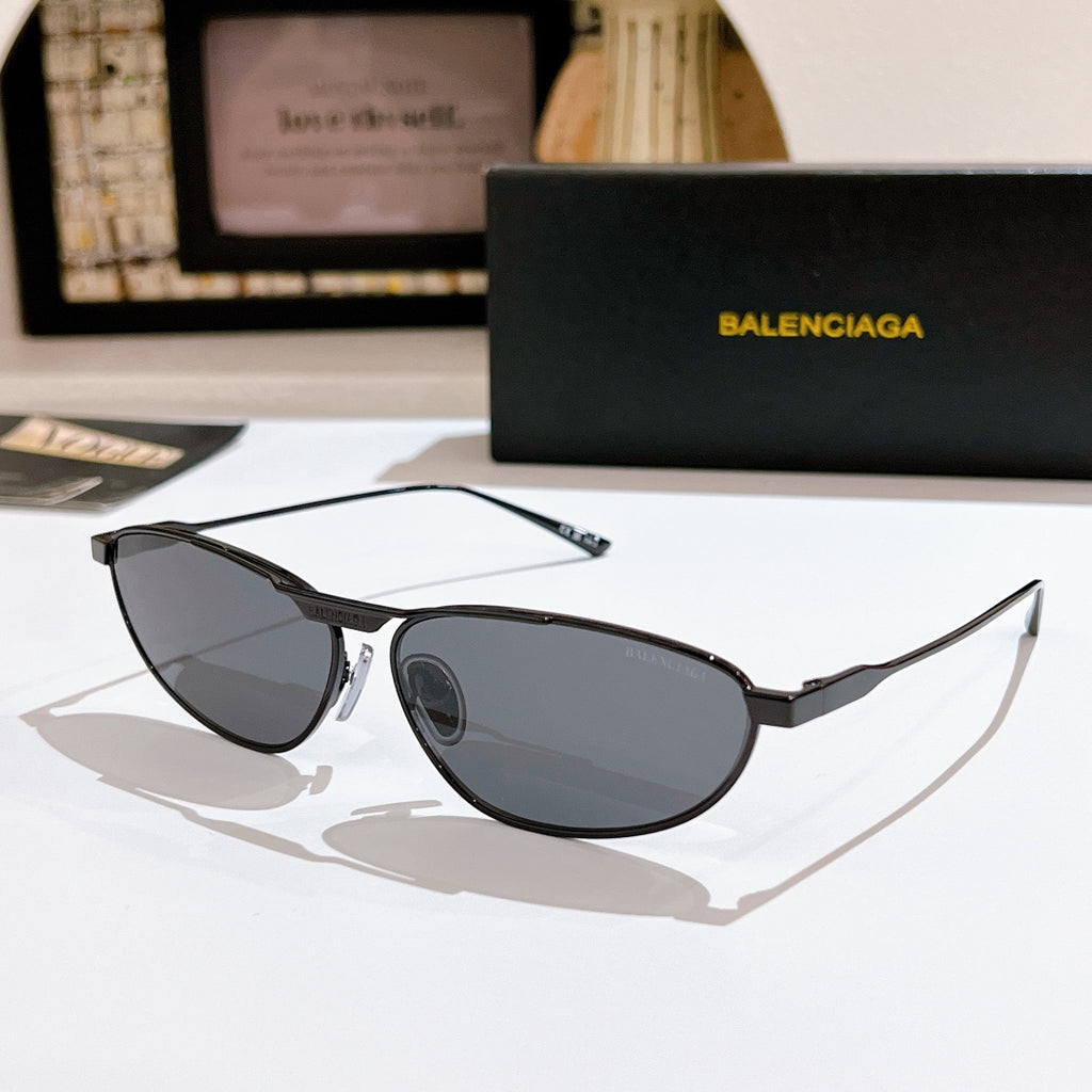 Oval dark gray tinted sunglasses with black metal frame and slim arms