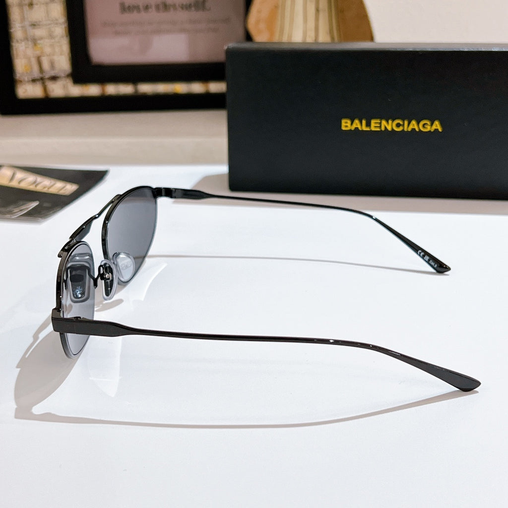 Side view oval black sunglasses with black metal frame and angled temple tips