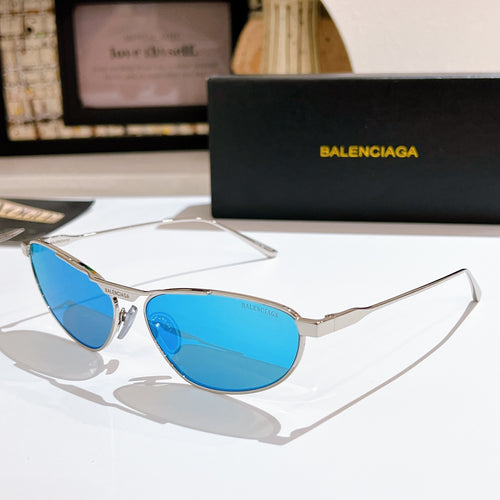 Oval blue tinted sunglasses with silver metal frame and thin temples