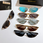 Assorted sunglasses with blue, brown, gray, and black lenses and mixed frames