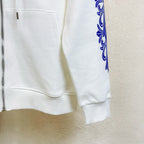 White hoodie pocket area with partial front zipper and blue sleeve graphic