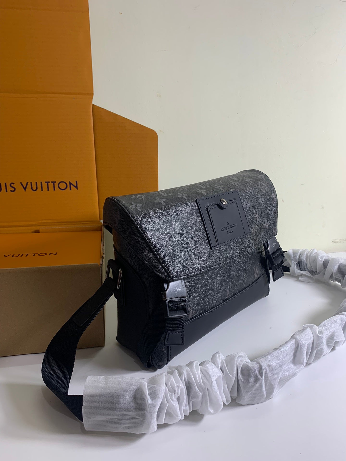 Louis Vuitton monogram crossbody bag angled view with flap and shoulder strap