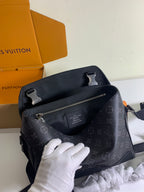 Louis Vuitton monogram shoulder bag with top handle, front zip pocket, and dark hardware
