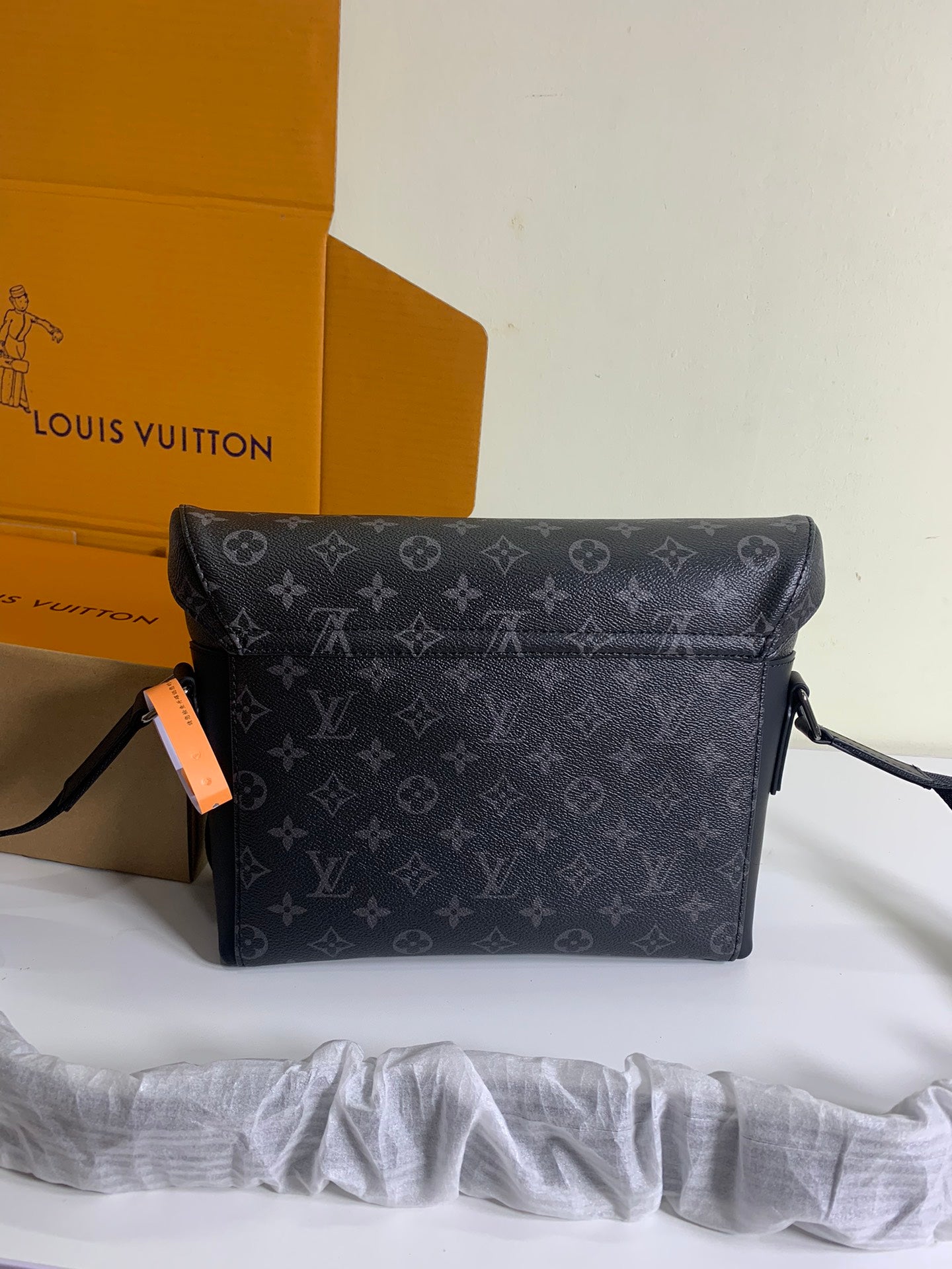 Louis Vuitton monogram crossbody bag front view with flap and strap attachments