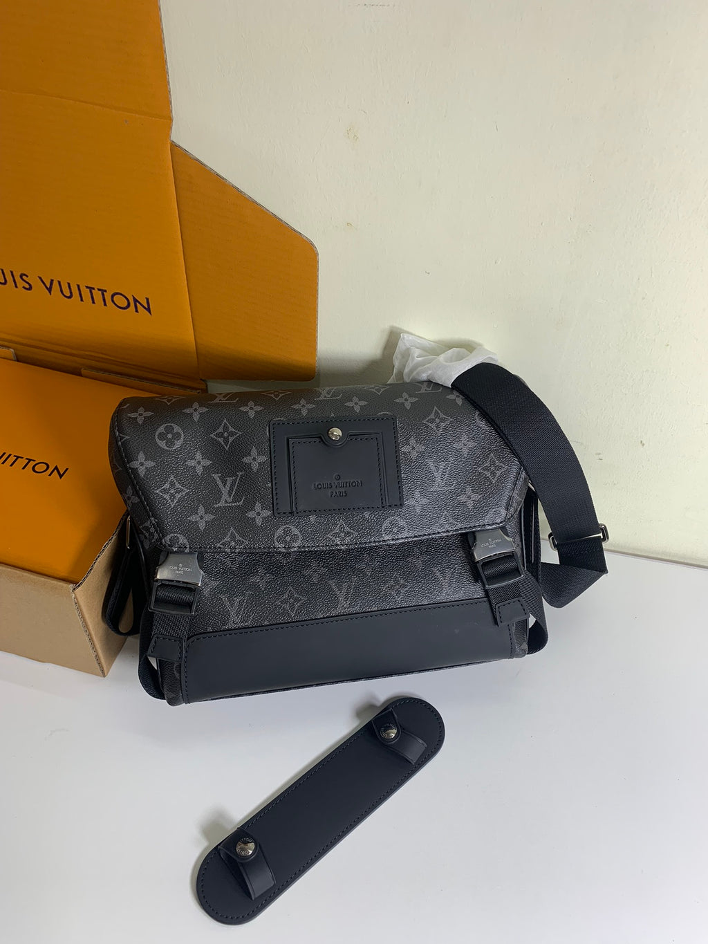 Louis Vuitton monogram shoulder bag with flap, adjustable shoulder strap, and front clasp