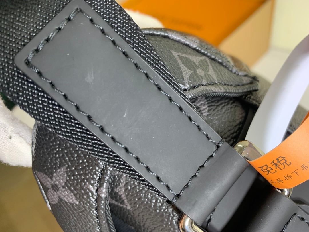 Louis Vuitton monogram bag close-up of stitched leather flap and front label panel