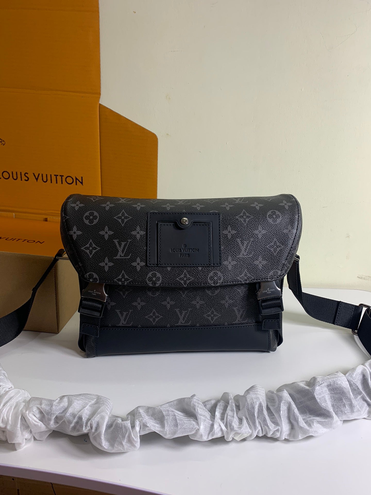 Louis Vuitton monogram crossbody bag with flap, front buckle, and adjustable strap