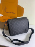 Louis Vuitton monogram crossbody bag in dark gray with adjustable strap.