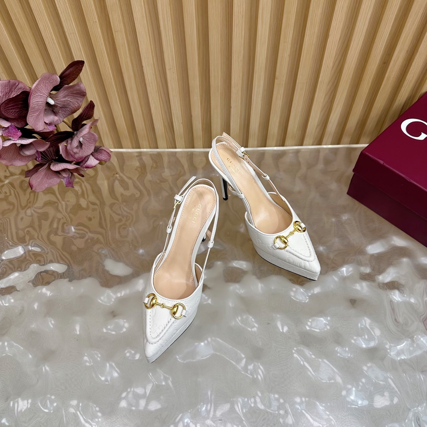 Gucci women's white high-heel pumps with gold horsebit buckle and ankle straps